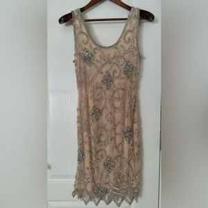 Short, sleeveless beaded dress. Size 4.